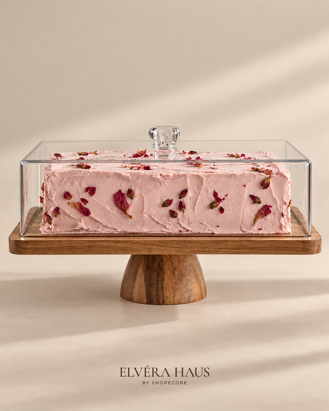 Acacia wood cake stand with clear acrylic lid and frosted cake