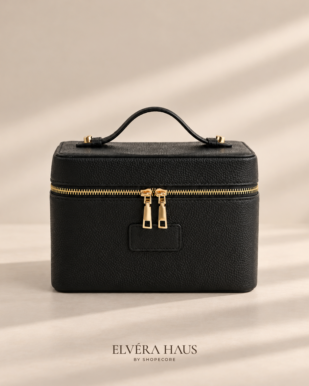 Black PU leather makeup case with gold zip and top handle