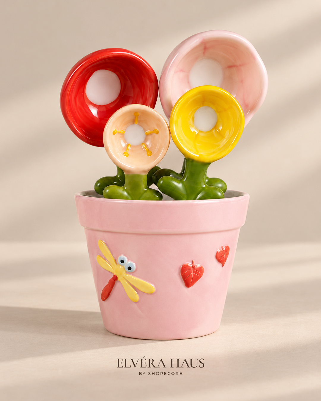 Ceramic flower measuring spoons in a pink hand-painted pot